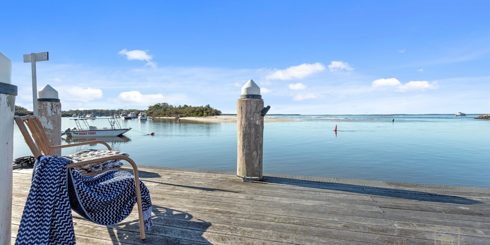 Jervis Bay Realty Holidays: relaxing on the jetty at Moona Moona creek while on a weekend away in Huskisson